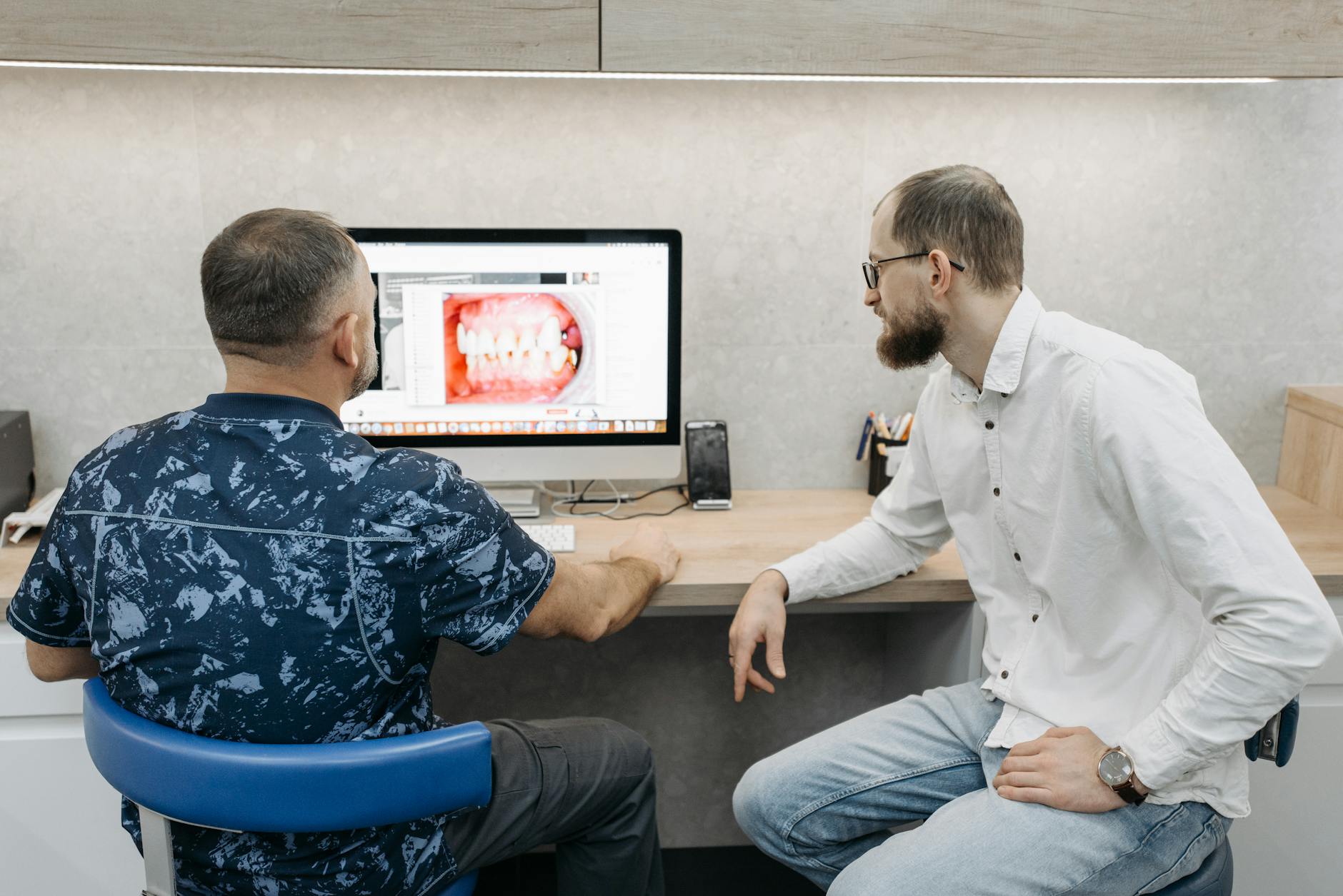 Dentists reviewing dental images on a computer